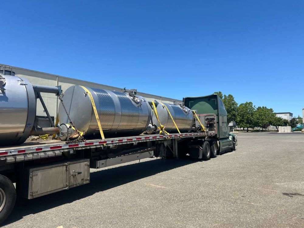 fermentation tanks on a flatbed